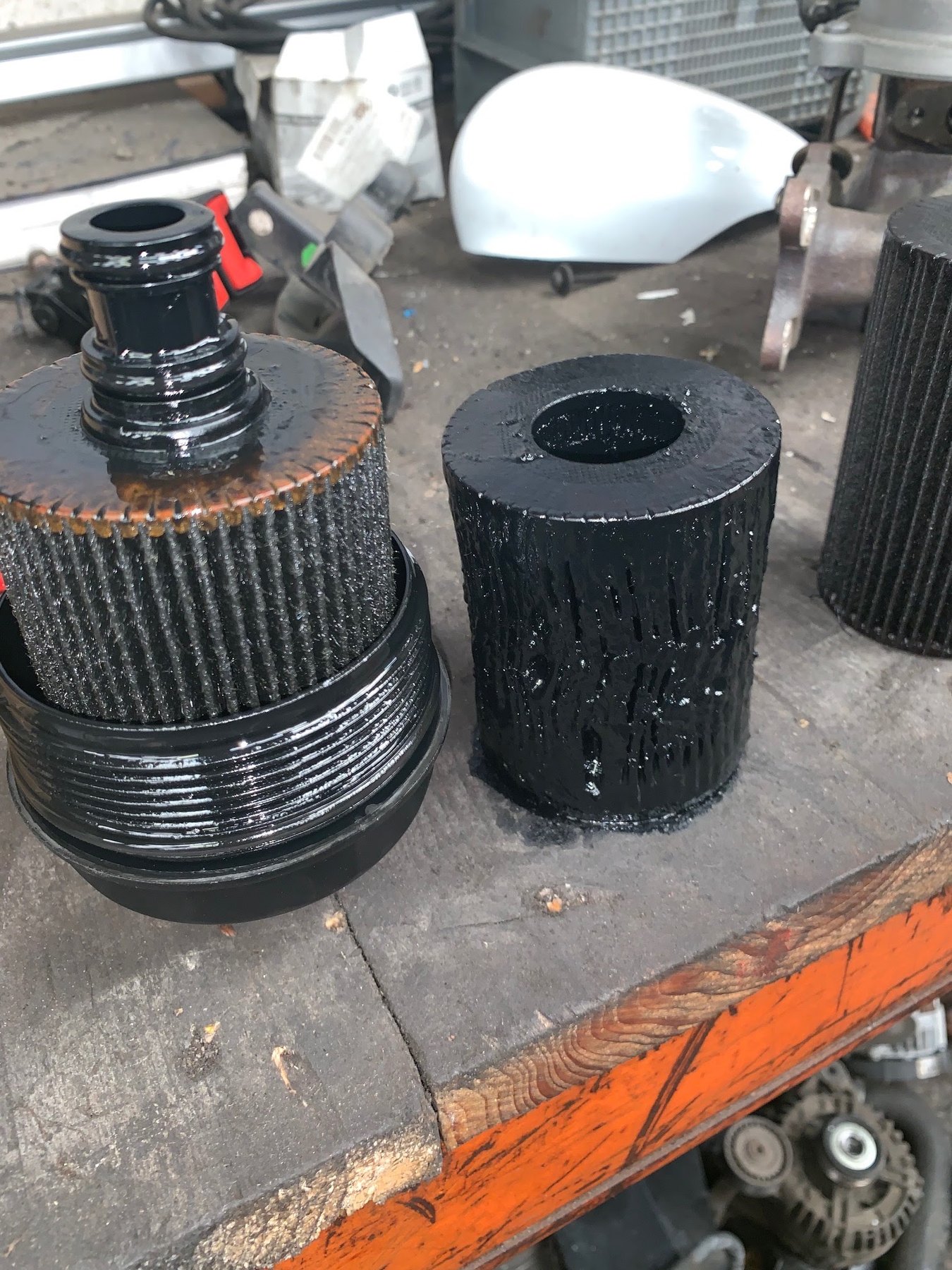 Used filter elements standing on the workbench after coming out of a car